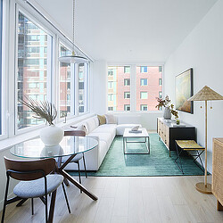 A living room with a large window.