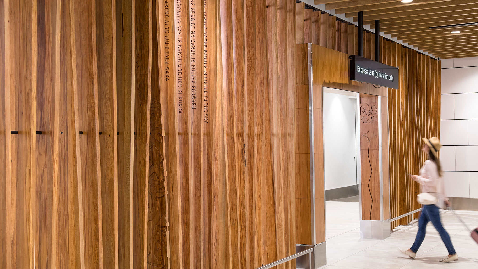 A person walking through a hallway.