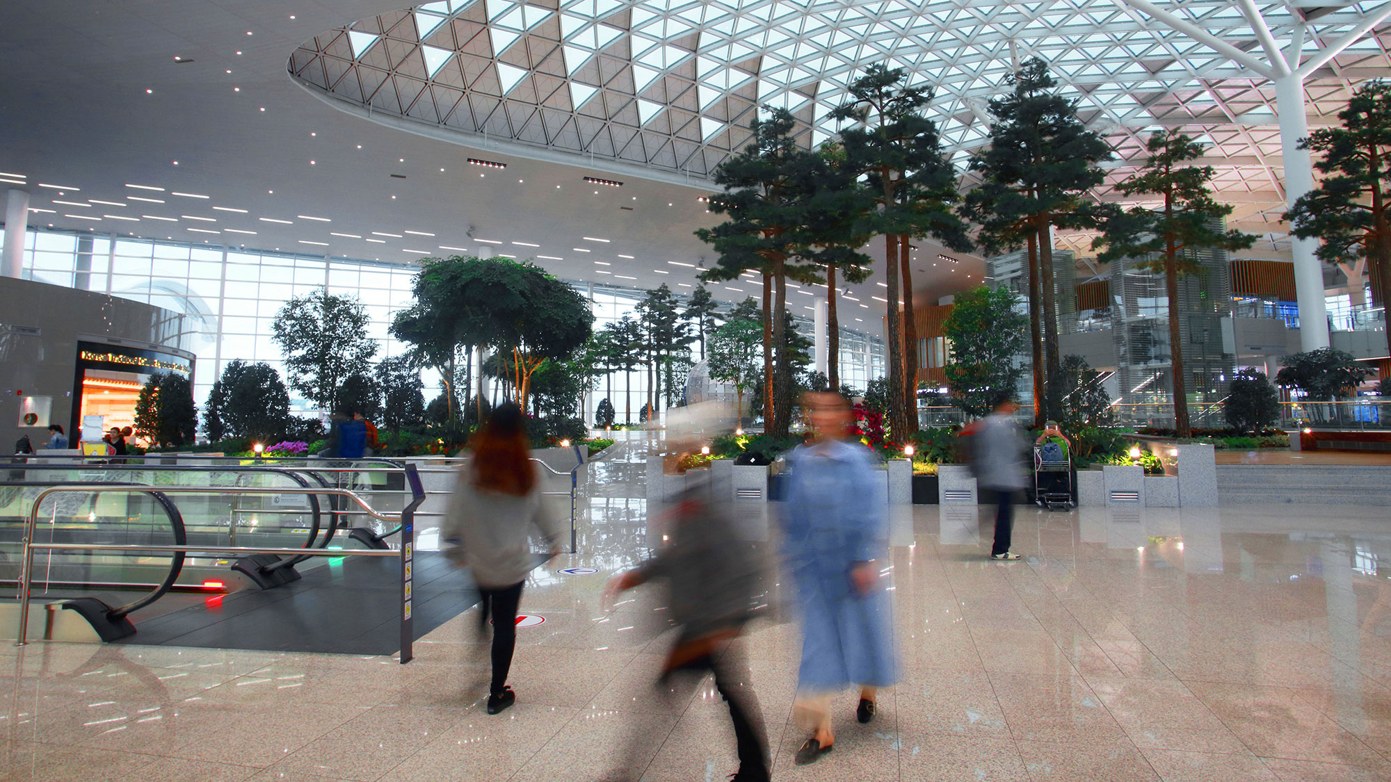 People walking in a large building.