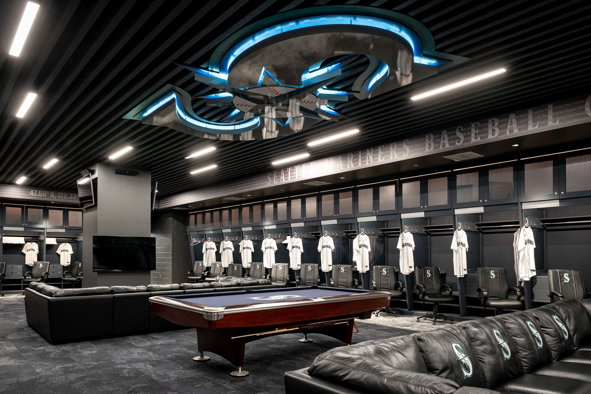 A room with a pool table and a pool table.