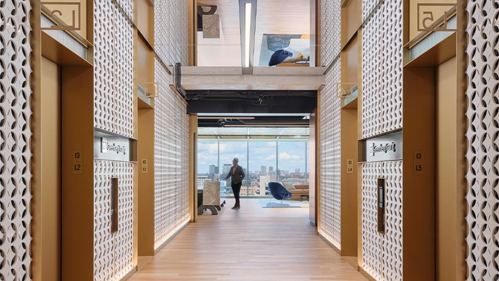 A person walking through a hallway.