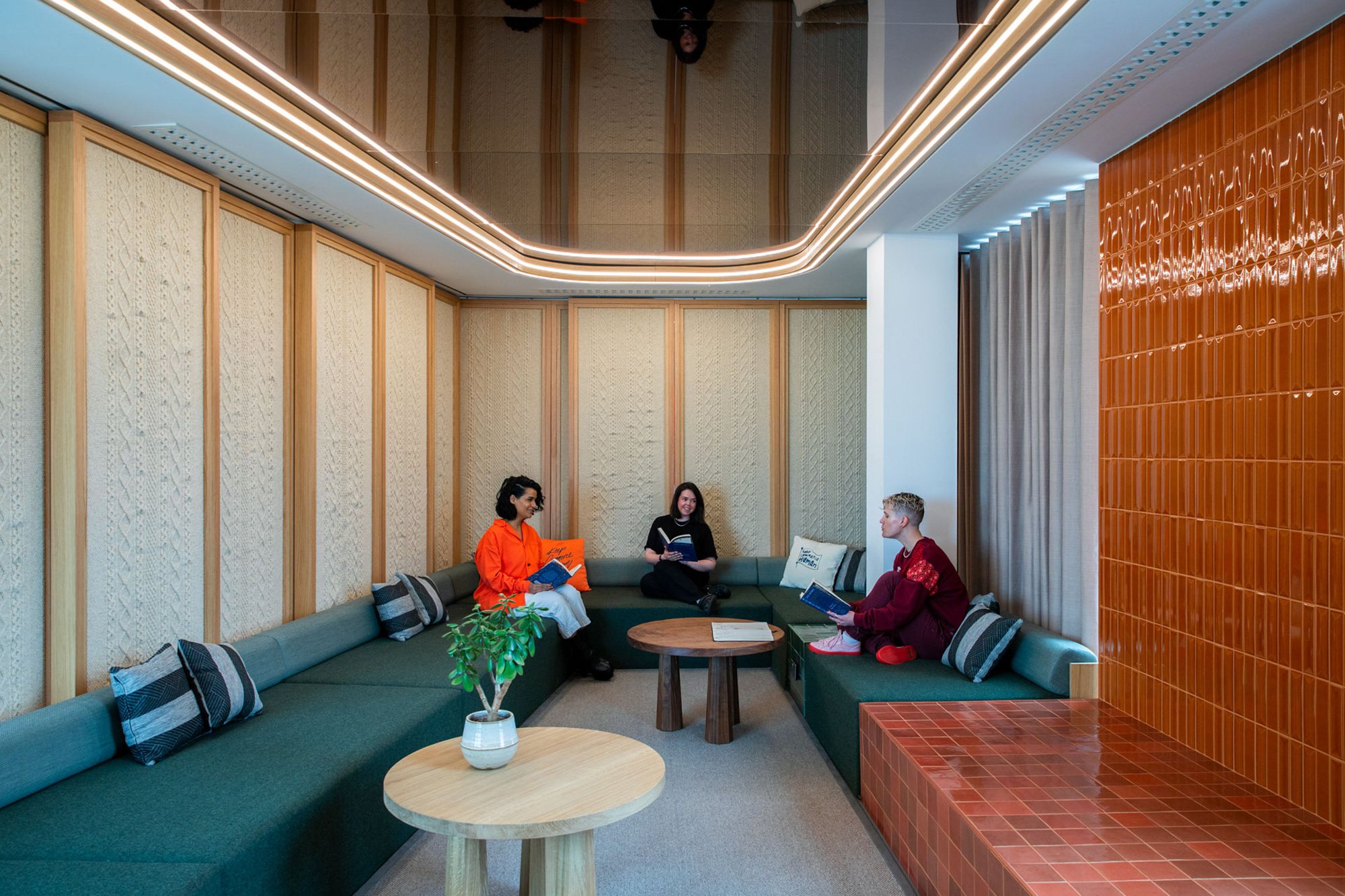 A group of people sitting on a couch.