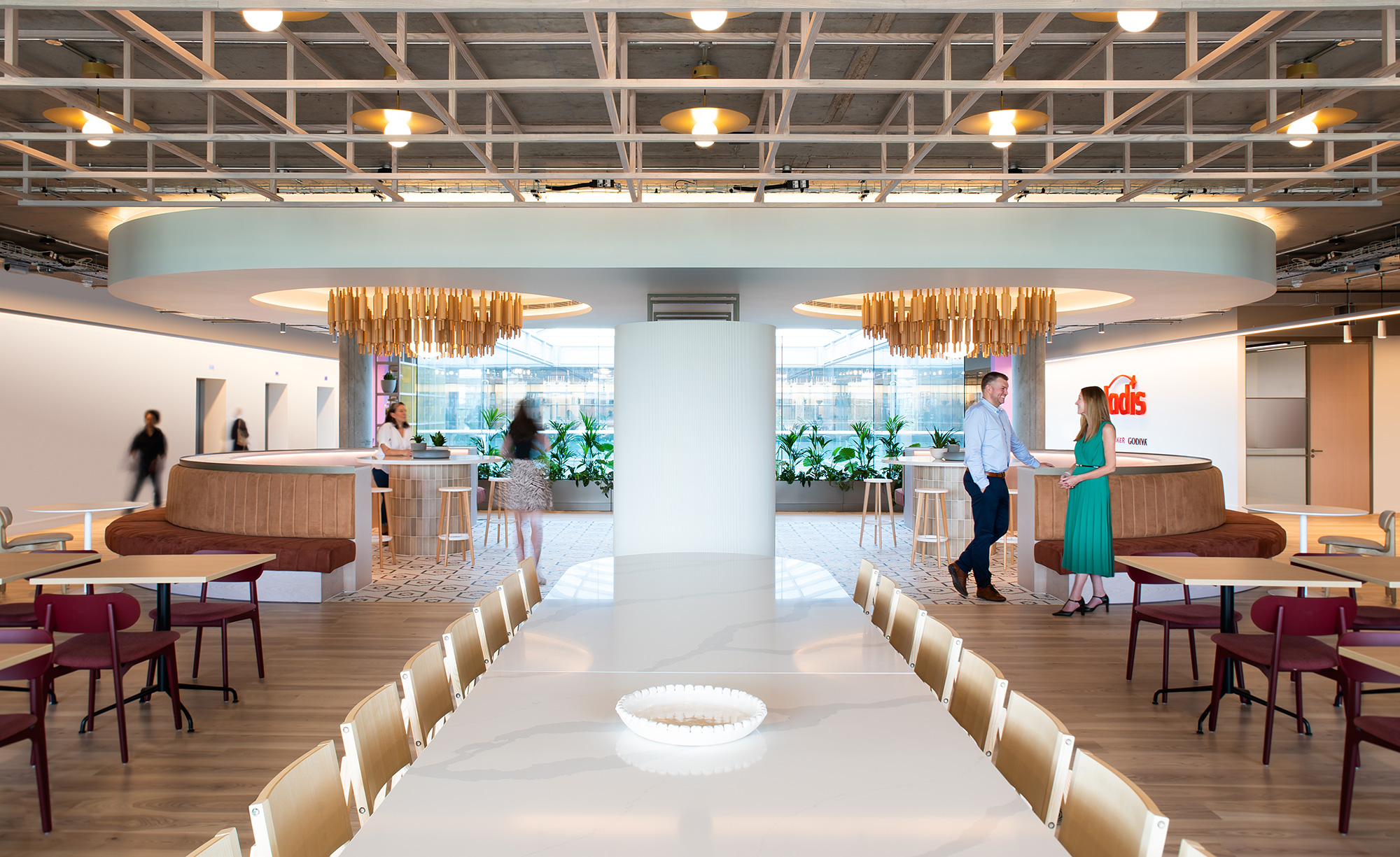 A large room with tables and chairs.