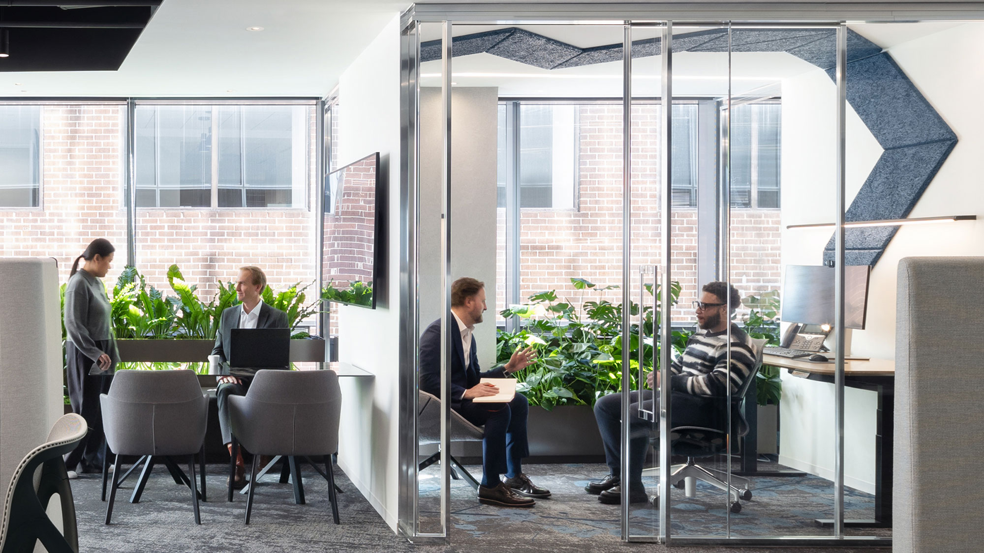A group of people sitting around a table.