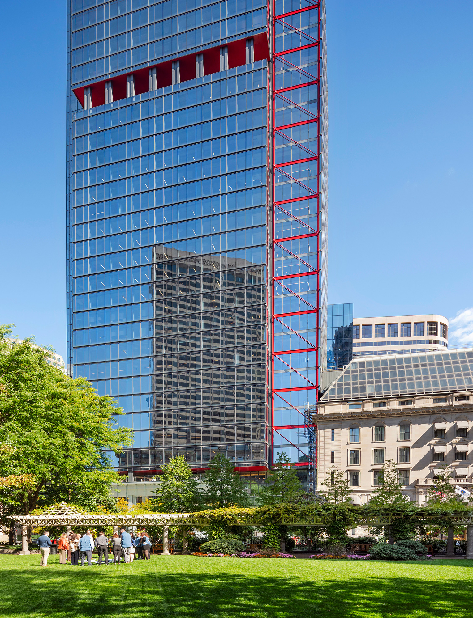 A tall building with a red ladder.
