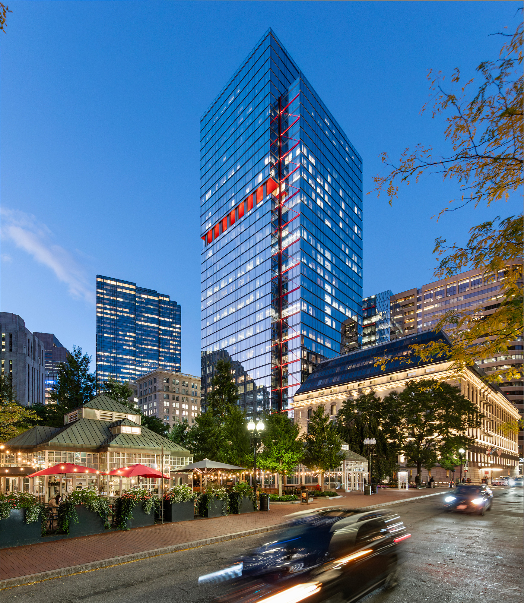 A tall building with a glass front.