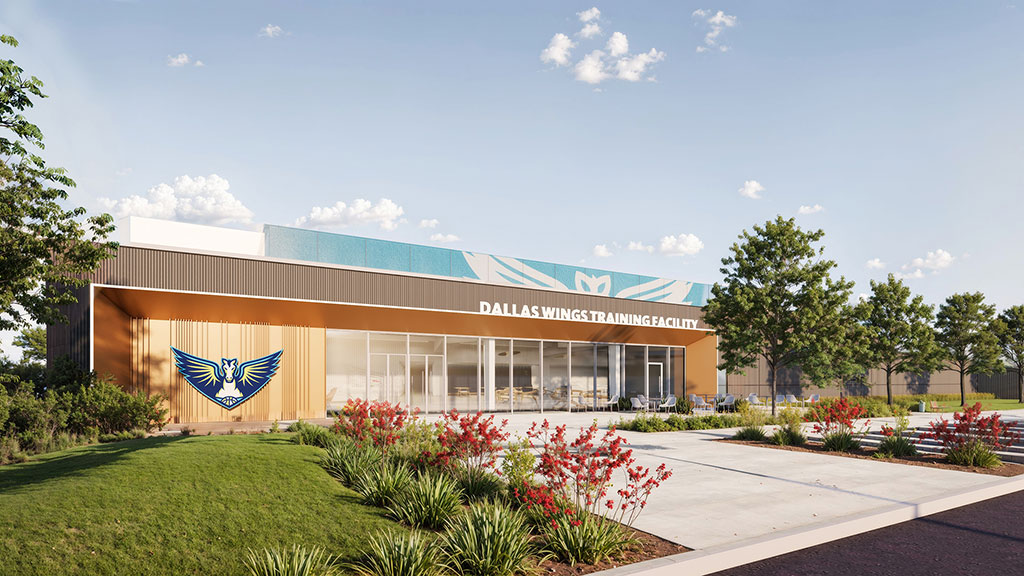 A building with a flag in front.