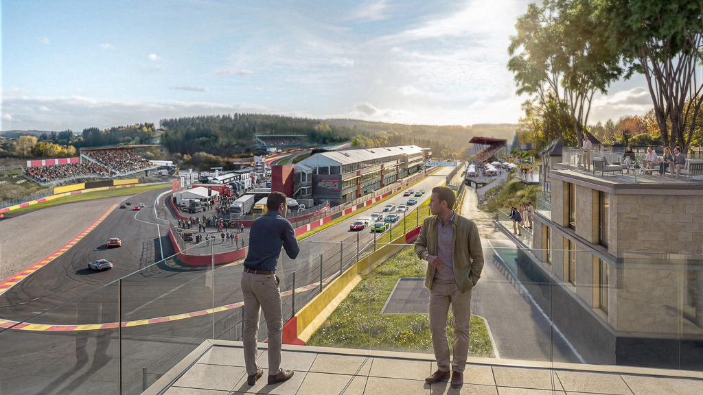 Two men standing on a bridge.