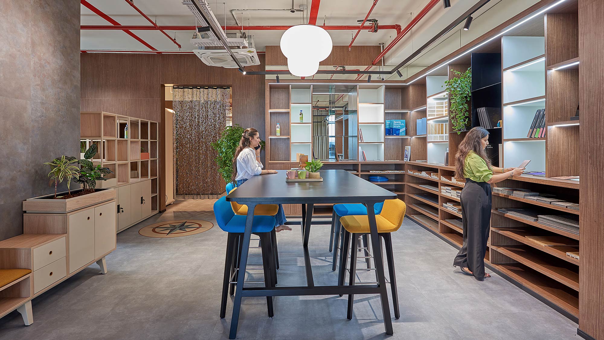 A few people in a library.