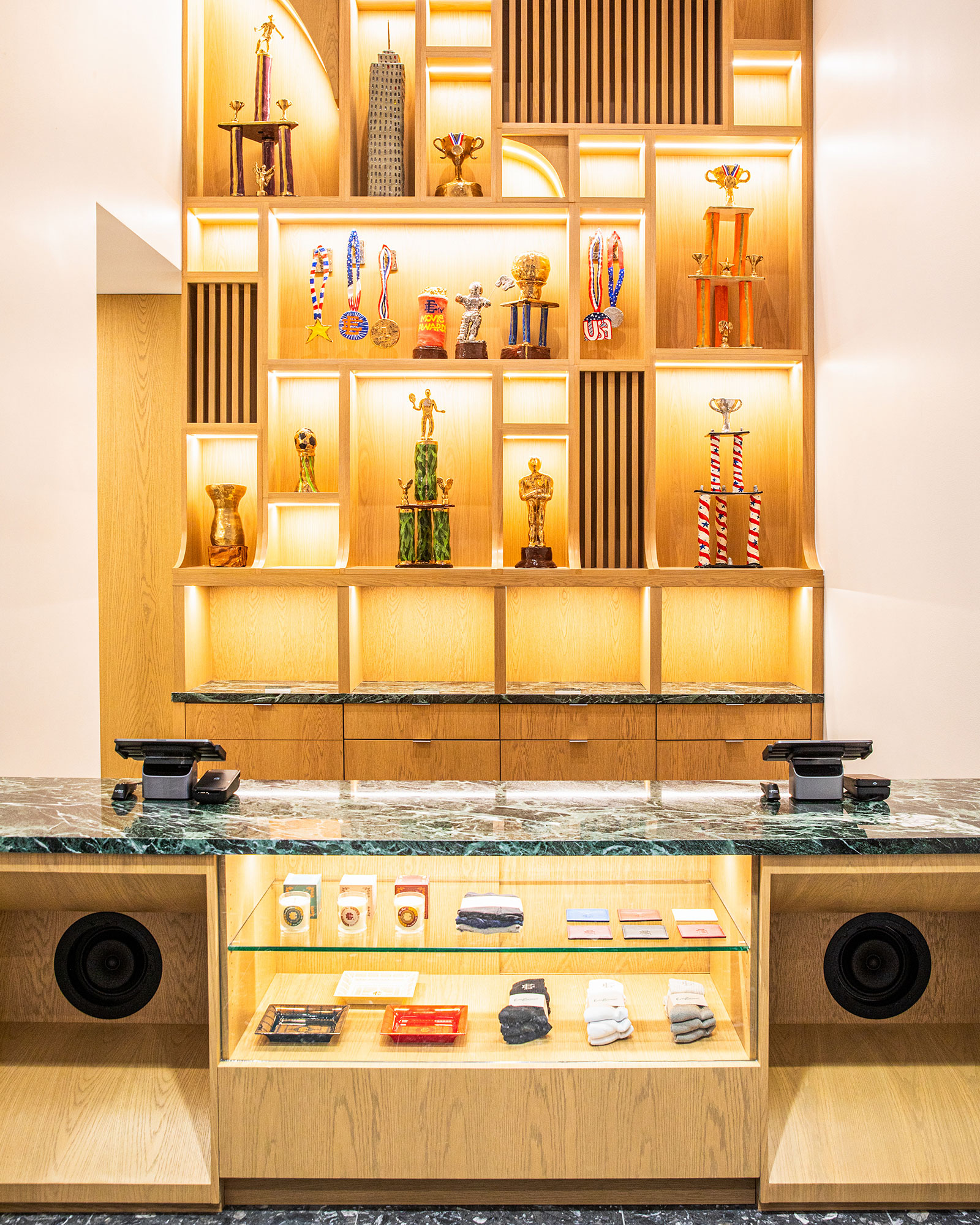 A shelf with trophies on it.