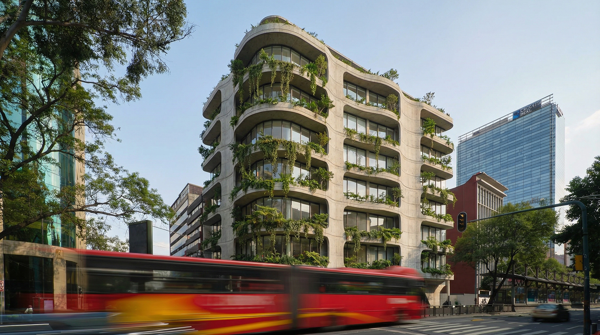 A red bus driving by a large building.
