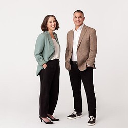 A man and a woman standing next to each other.