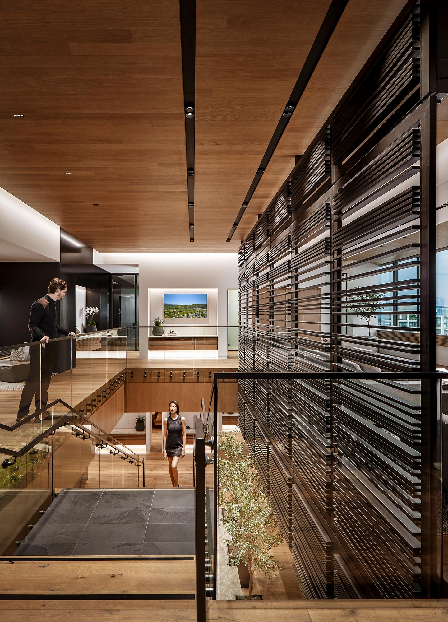 A man and woman walking up stairs.