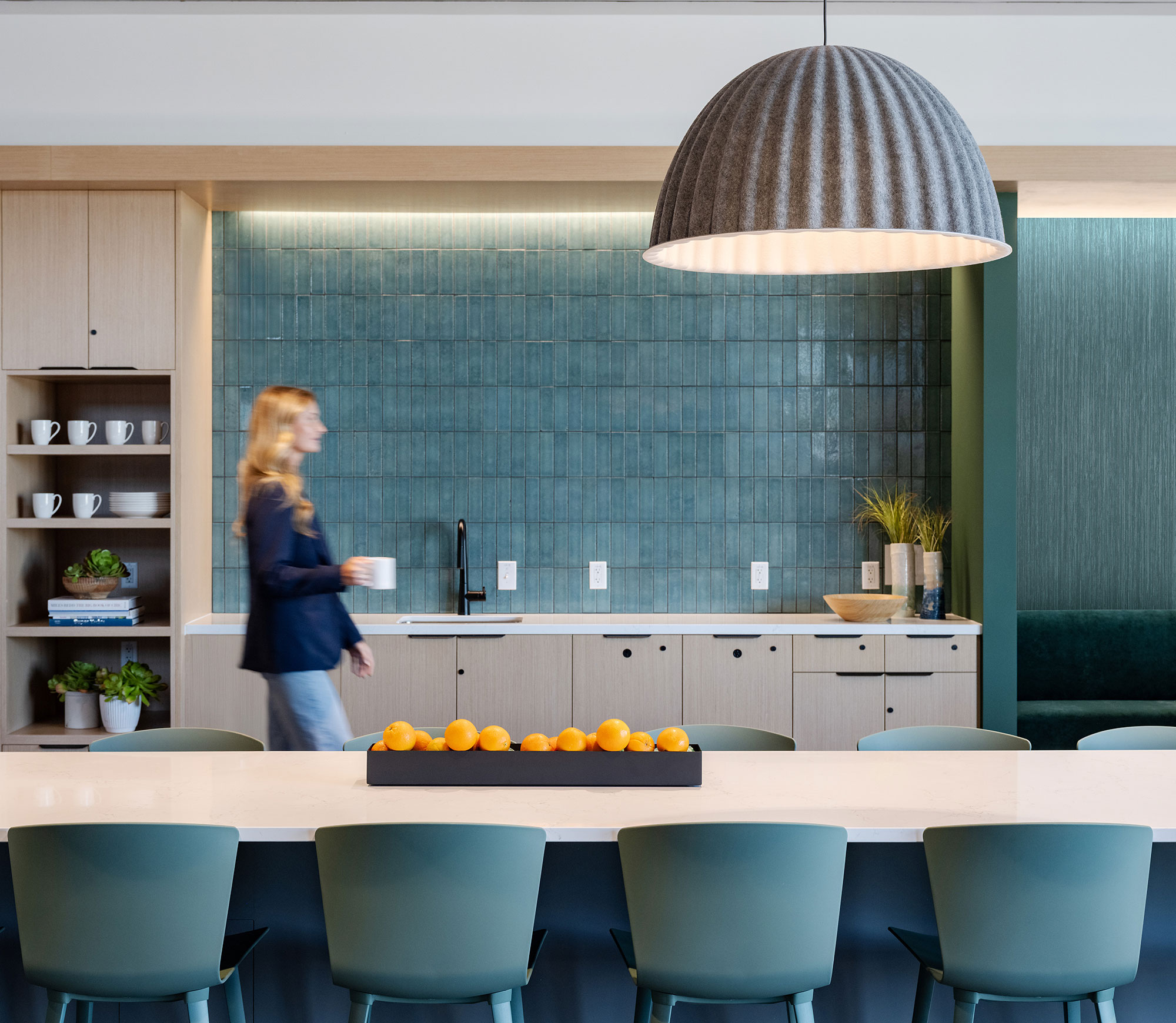 A person standing in front of a chalkboard.