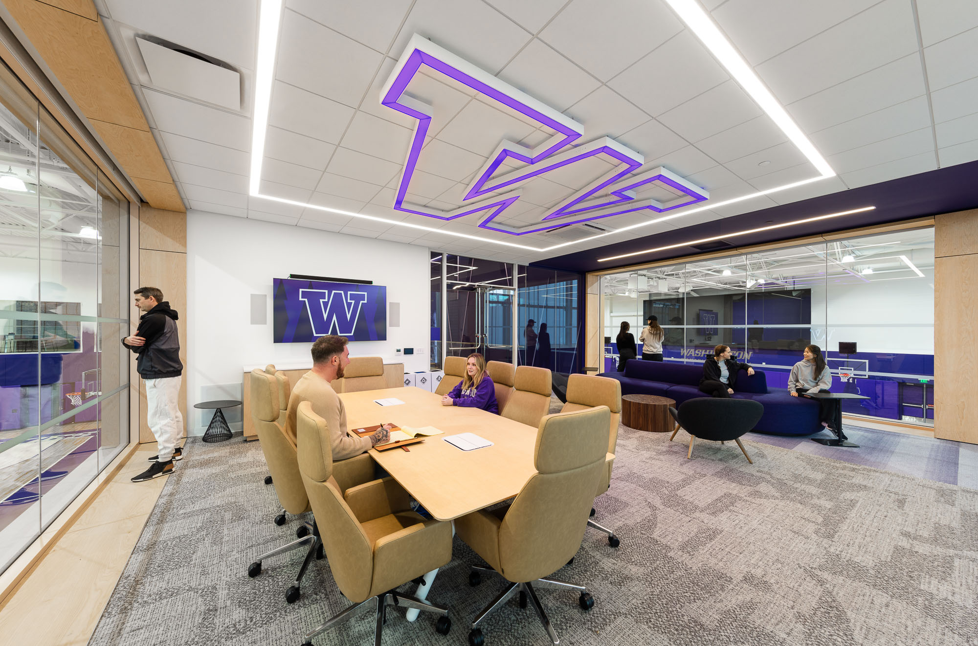 A group of people in a conference room.