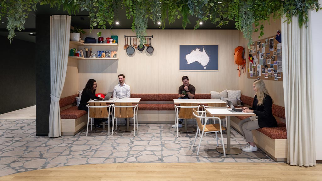 A group of people sitting around a table.