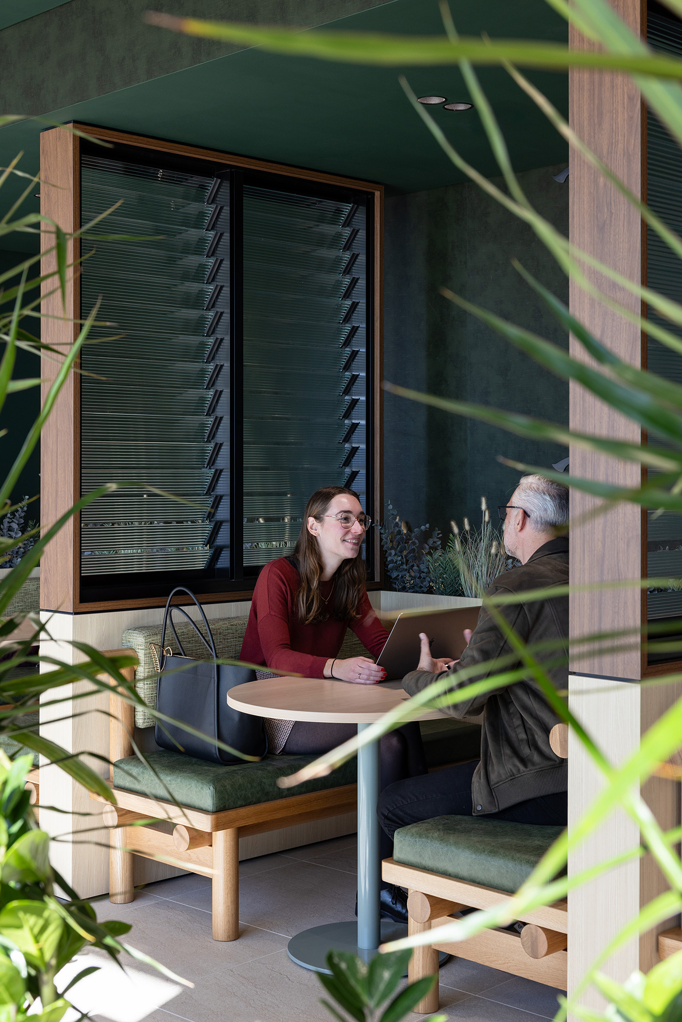 A man and woman sitting at a table.