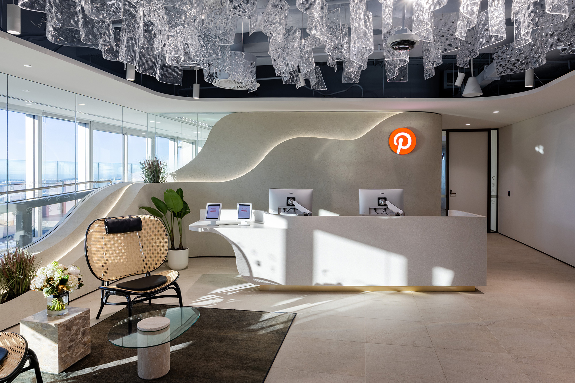 A room with a large white table and chairs.