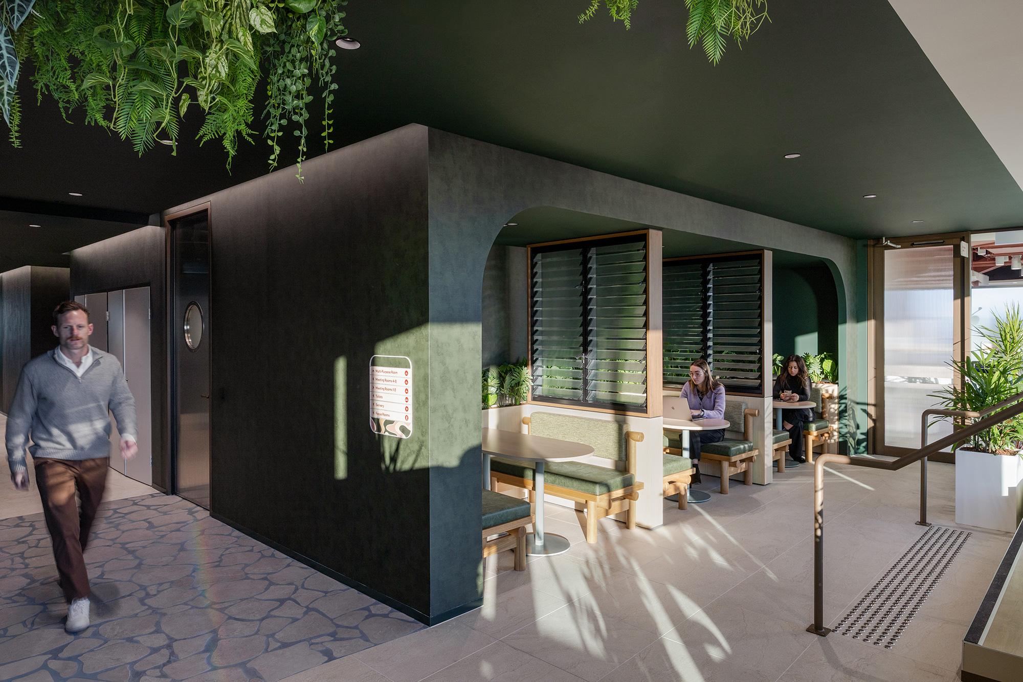 A man walking outside of a building.