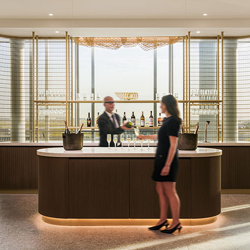 A person standing at a bar.