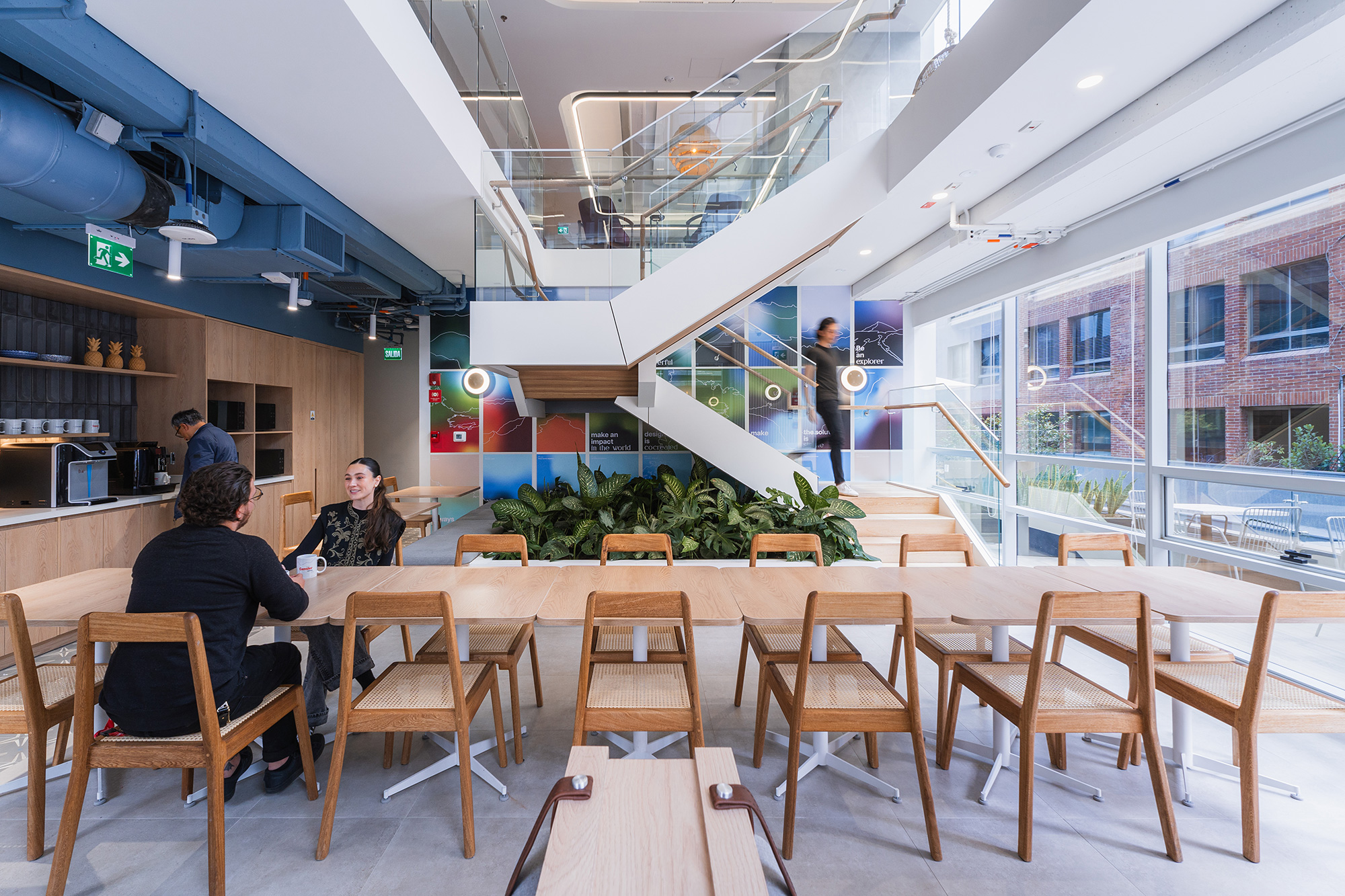 A group of people sitting at tables.