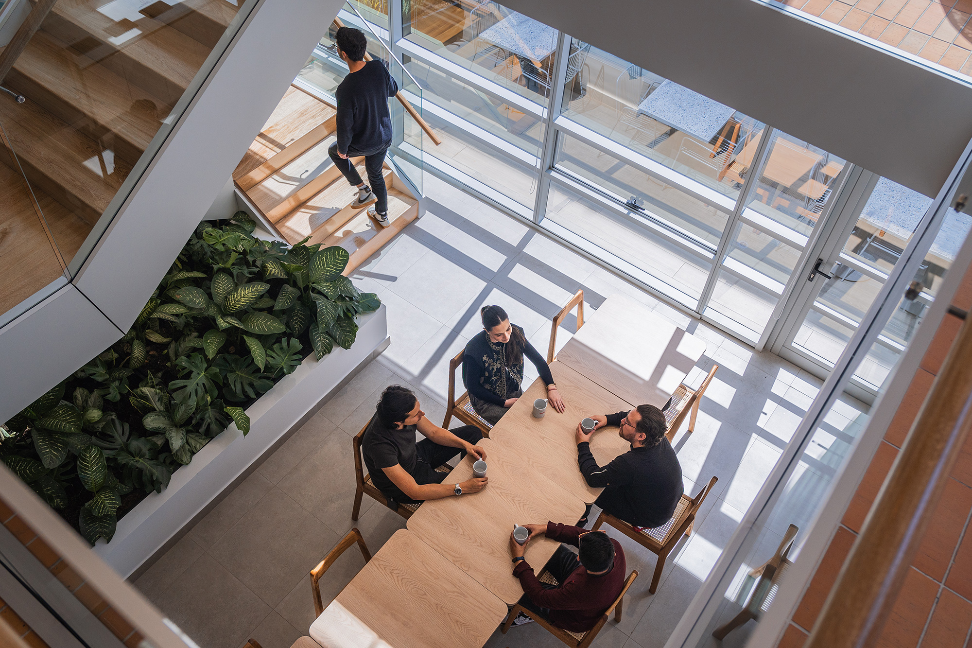 A group of people sitting on a balcony.