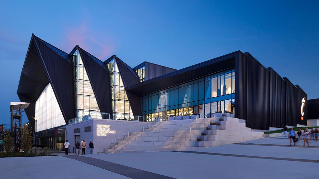 A building with stairs and people outside.