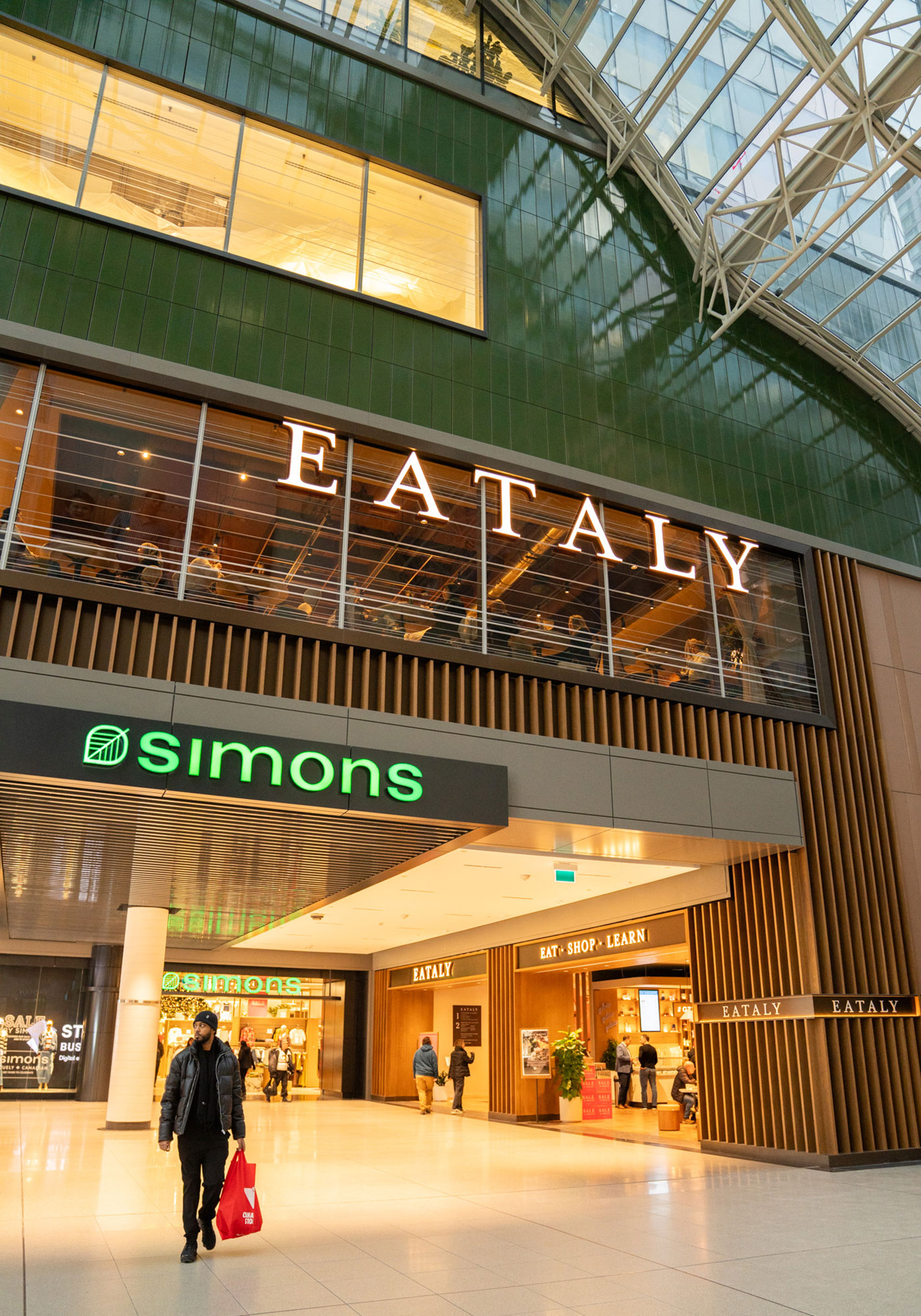 A person walking in a large building.