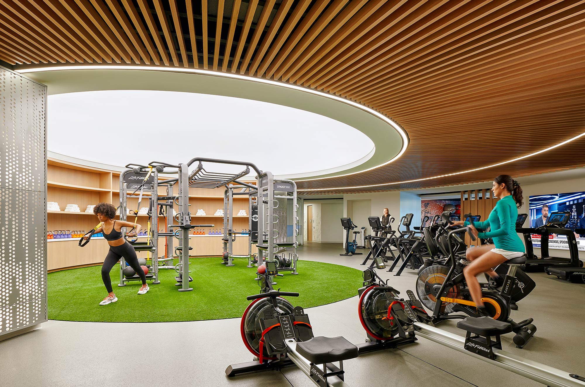 A woman and a man playing golf.