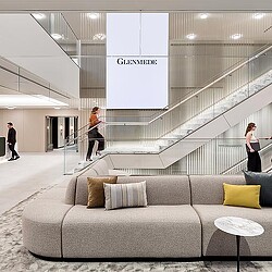 A group of people walking down a staircase.