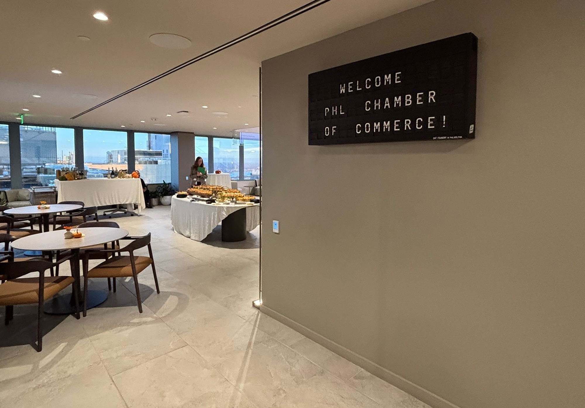 A room with tables and chairs.