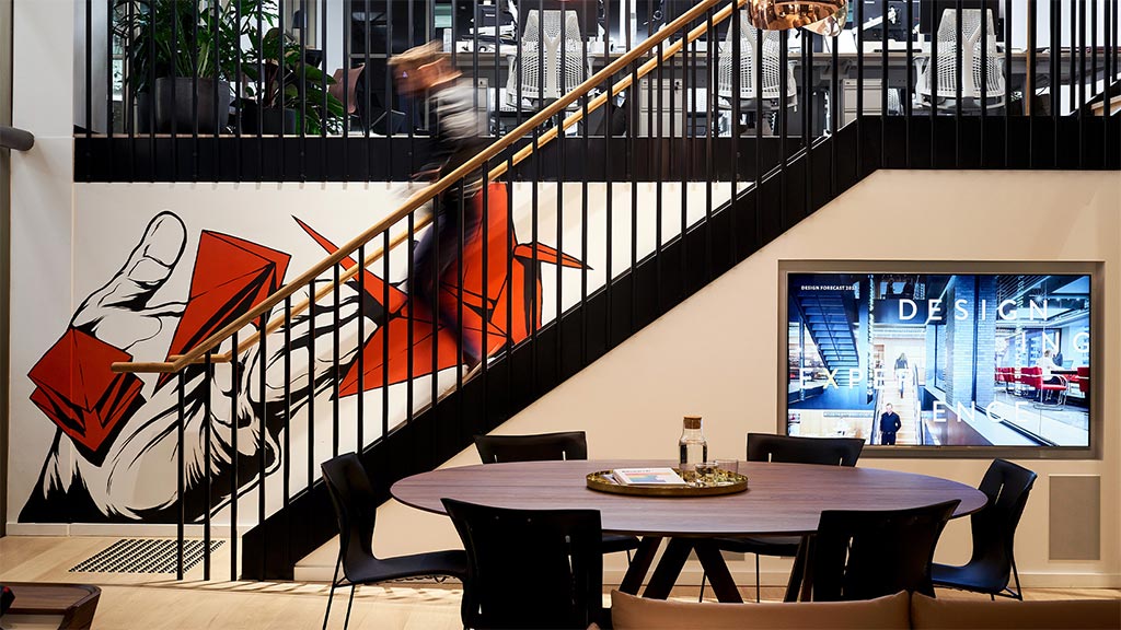 A room with a table and chairs.