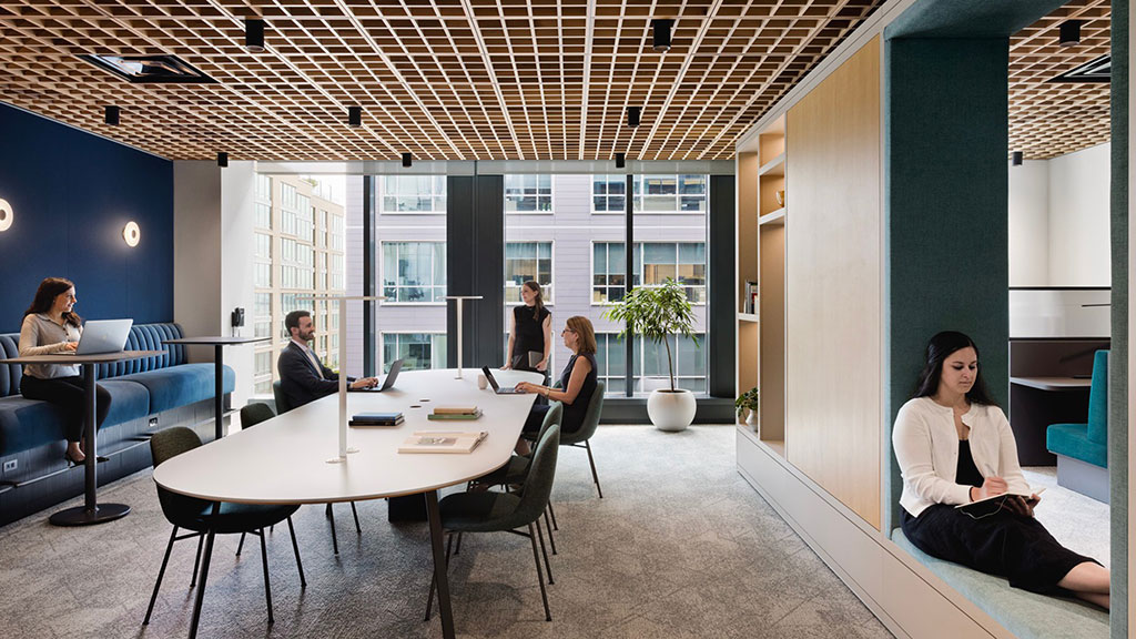 A group of people sitting around a table.