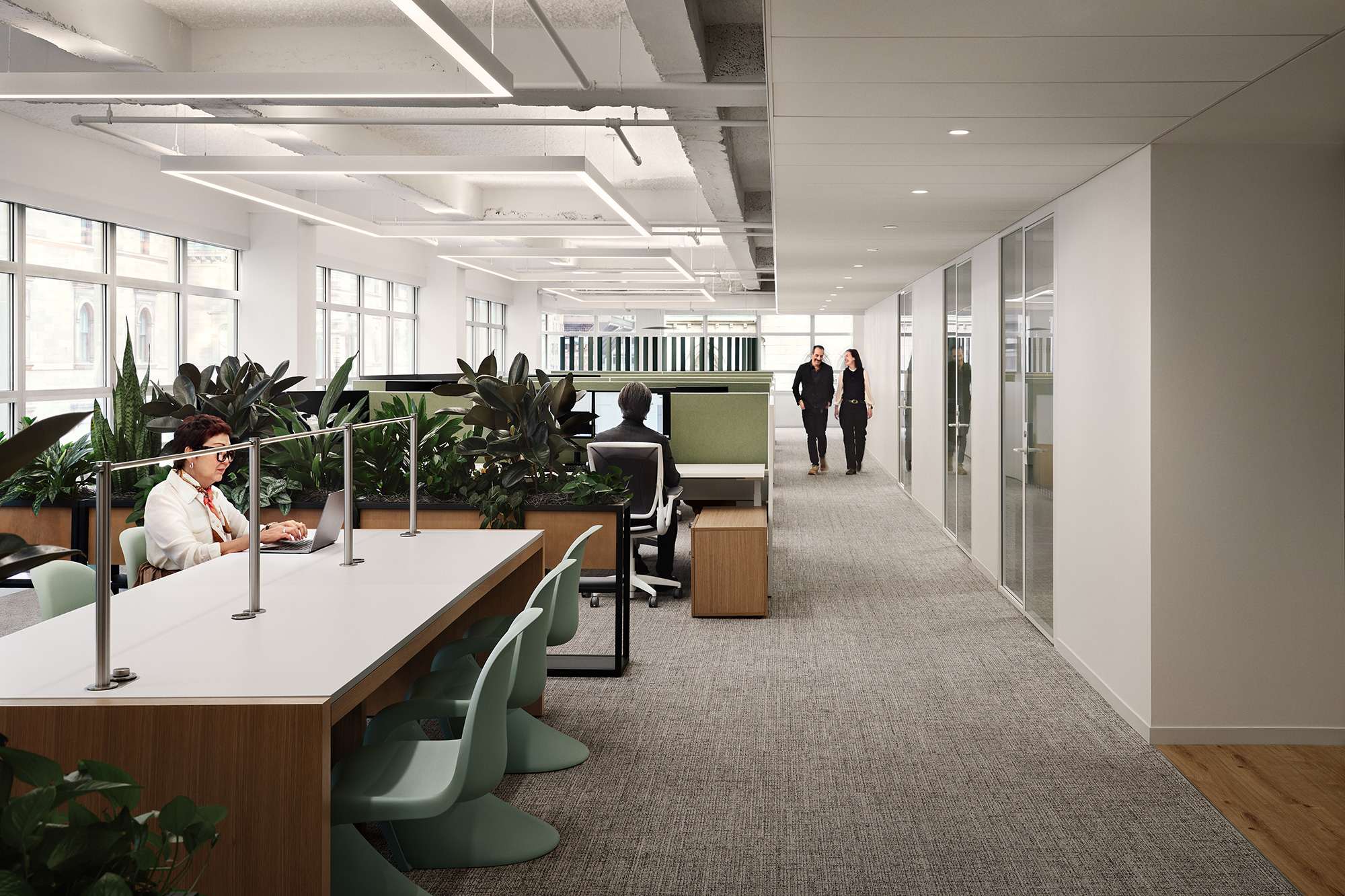 A person sitting at a desk in an office.