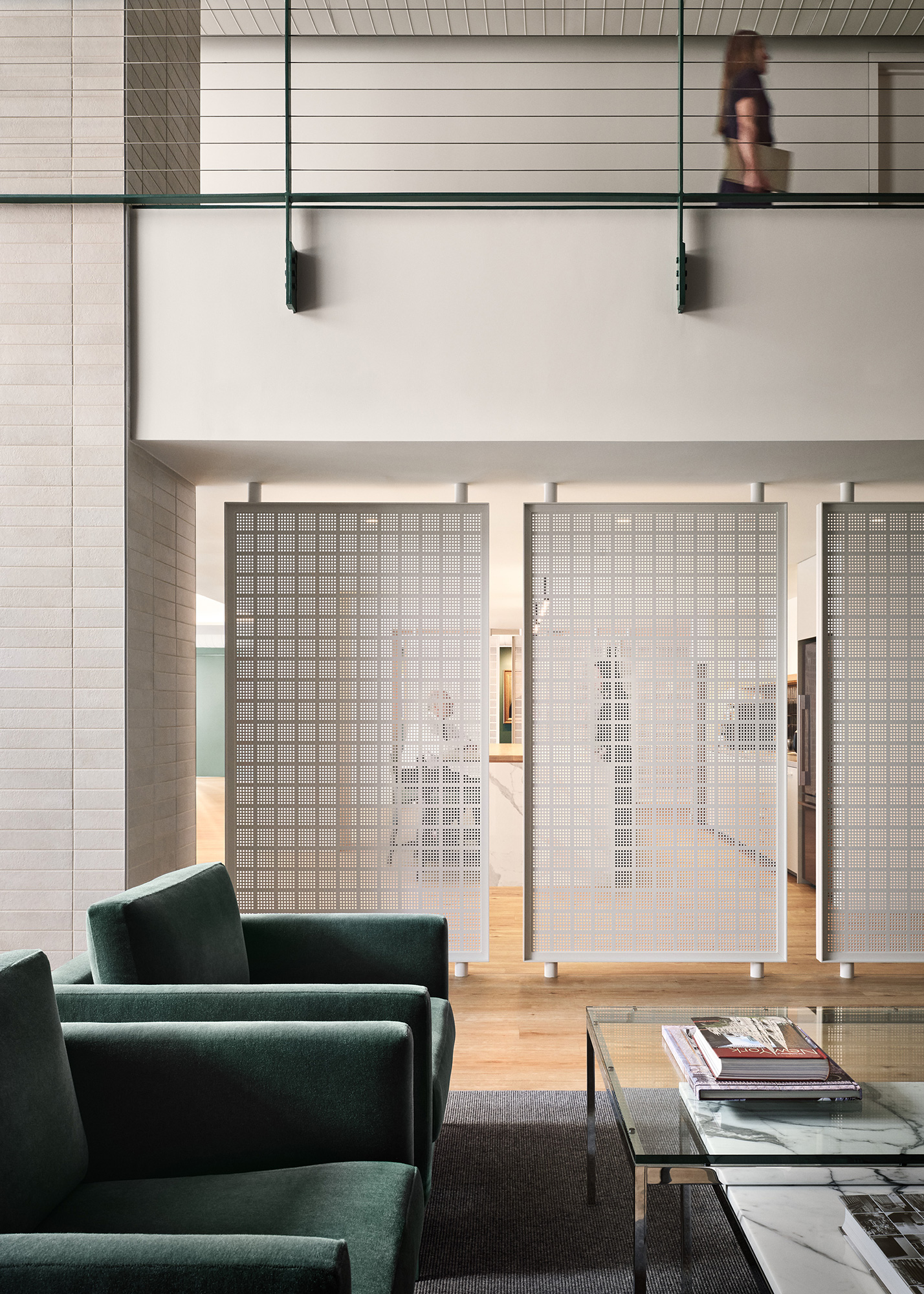 A room with a table chairs and a window.