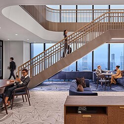 People sitting at tables in a room.