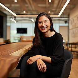 A woman sitting at a table.