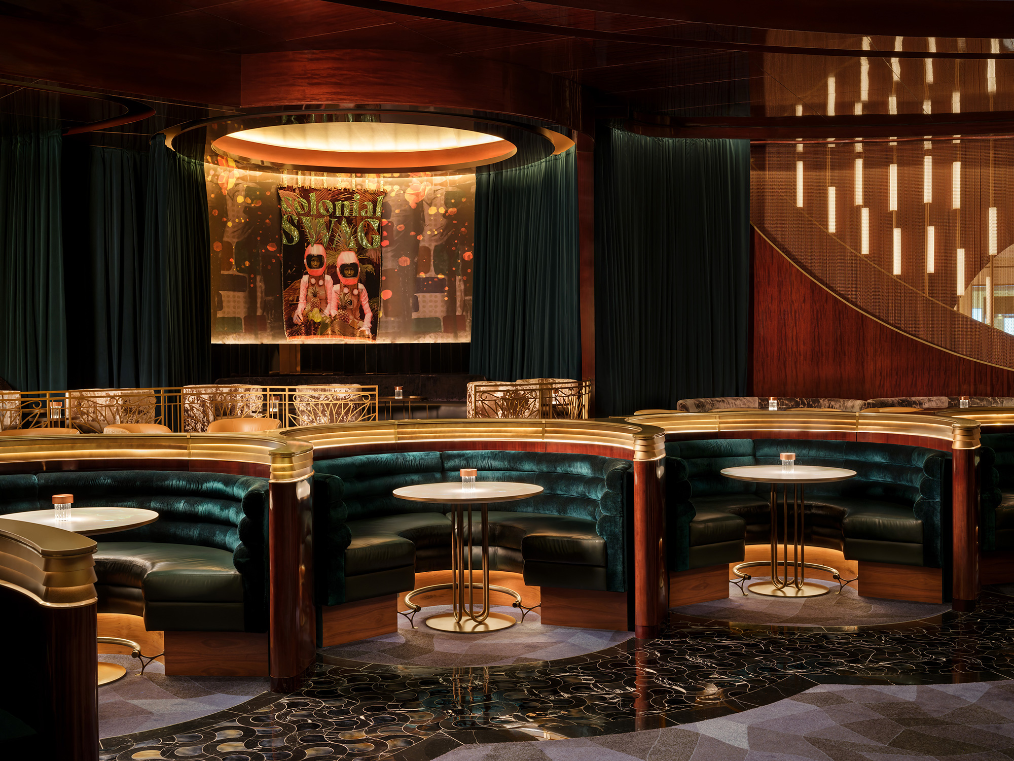 A room with a stage and chairs.