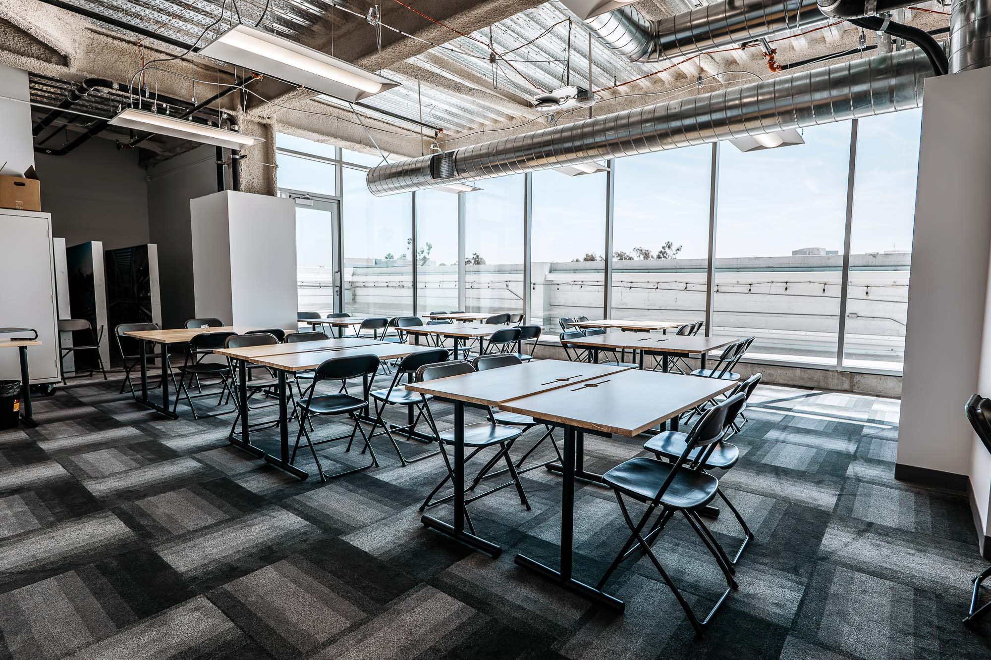 A room with tables and chairs.