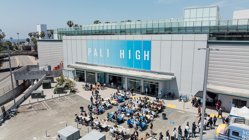 A group of people outside of a building.