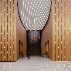 A person walking in a large hall.