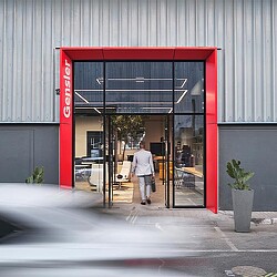 A person walking out of a building.