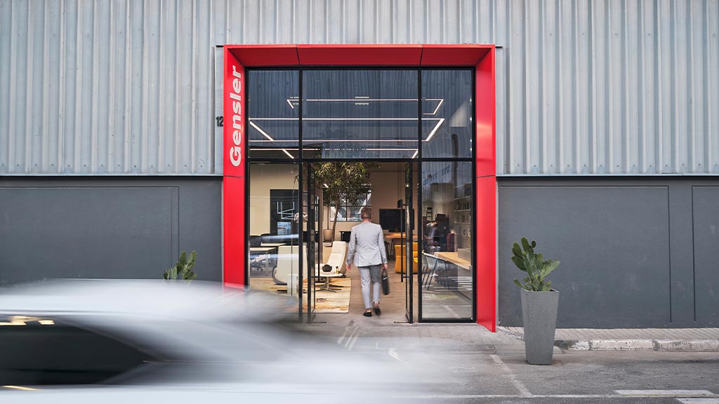 A person walking out of a building.