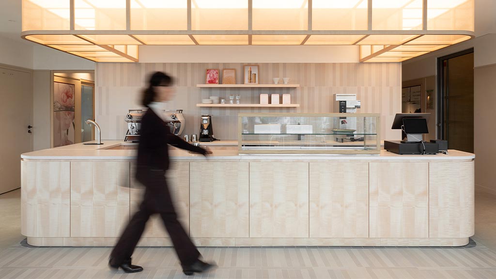 A person walking in a kitchen.