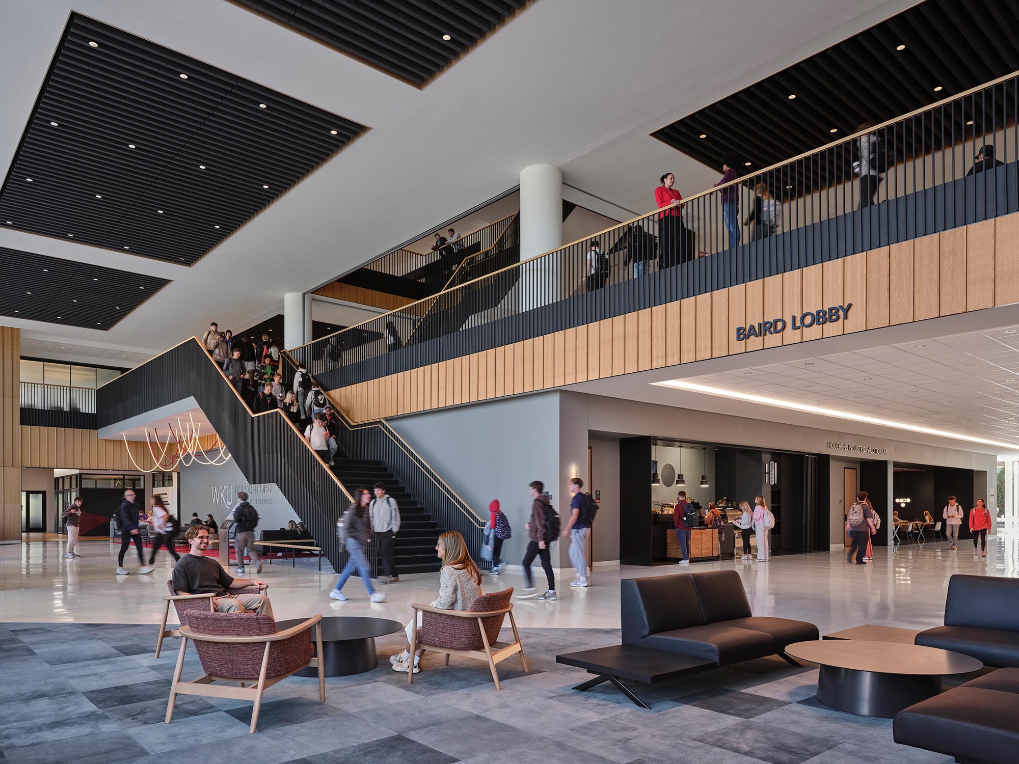 A group of people walking up stairs.
