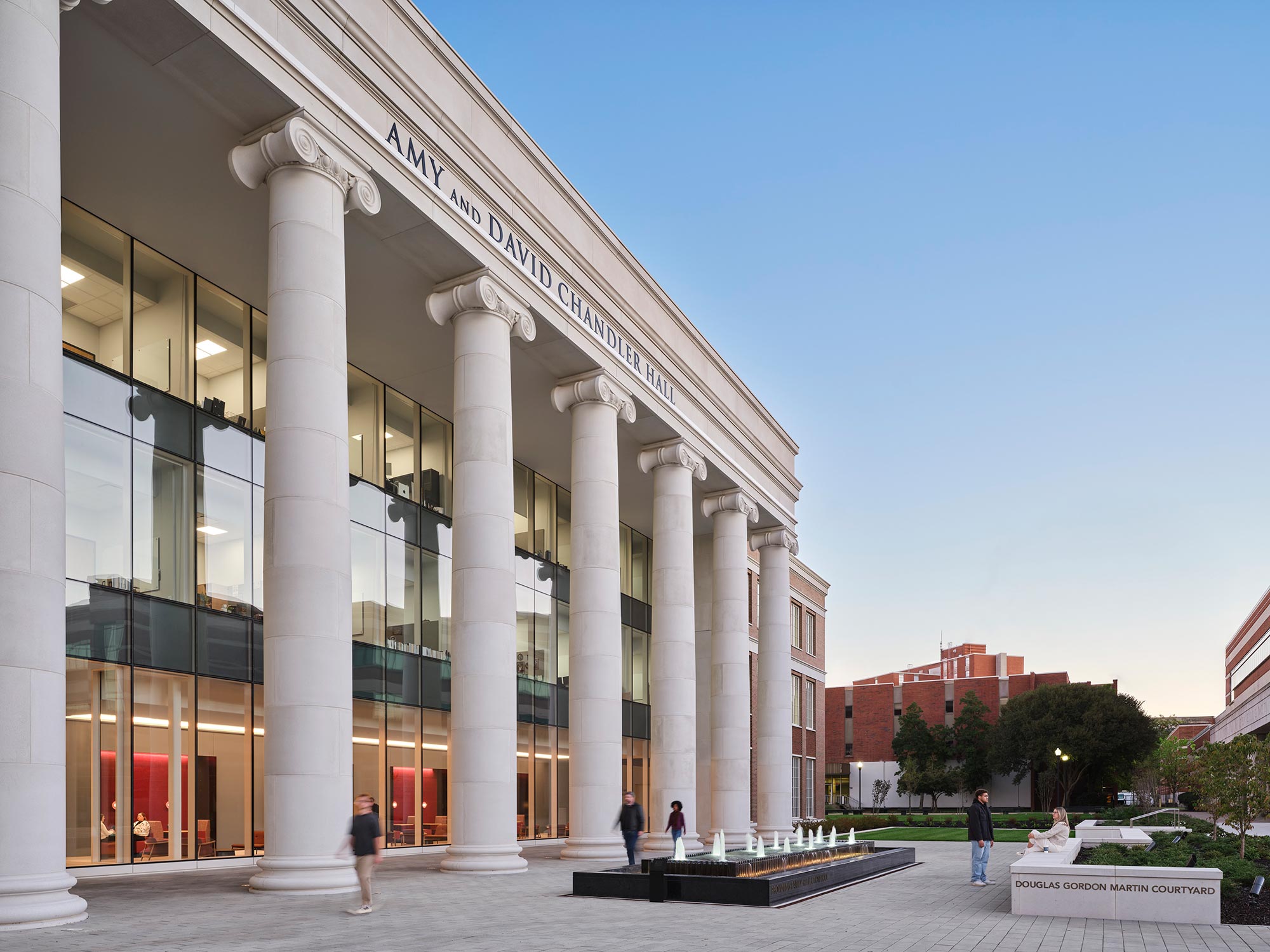 A building with columns and a fountain.