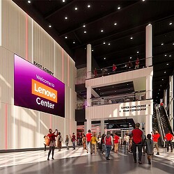 A group of people walking in a large building.