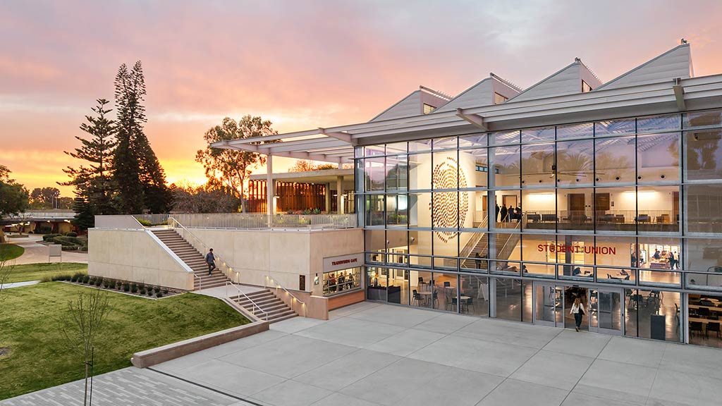 A building with stairs and glass windows.