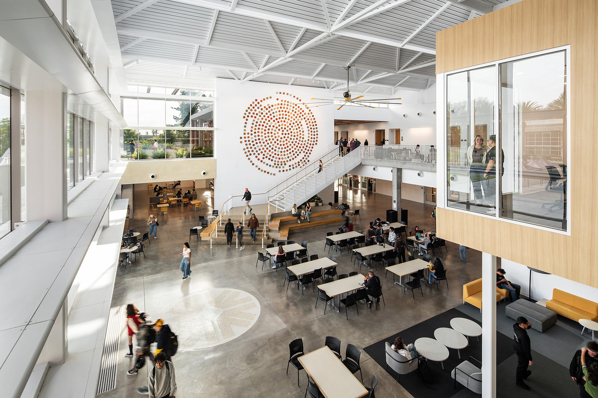 A large room with tables and chairs.