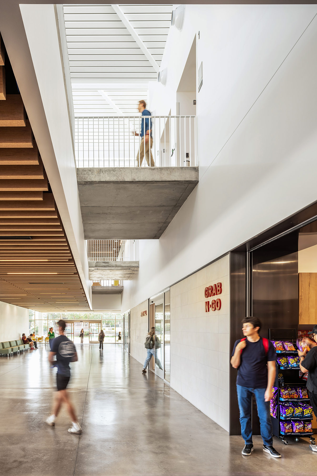 People walking up a staircase.